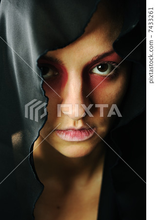 very pretty woman with dark neckerchief on head, sensual sexuality gaze 7433261