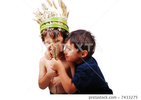 Two cute kids holding wheat piece in hands Two cute kids holding wheat piece in hands 7433275