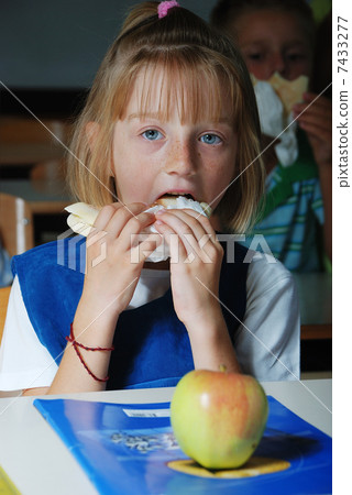 Little cute girl in classroom, eating Little cute girl in classroom, eating 7433277