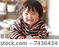 Laughing one year old girl 7436434