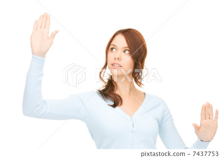 businesswoman working with something imaginary 7437753