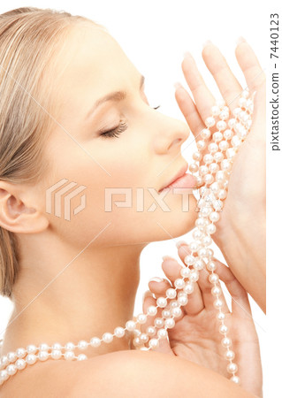 beautiful woman with pearl beads 7440123