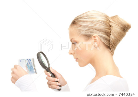 woman with magnifying glass and money 7440384