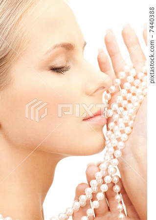 beautiful woman with pearl beads 7440388