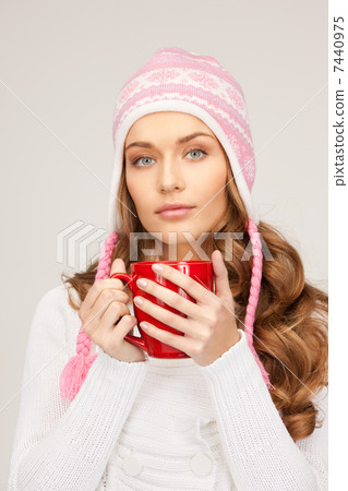 beautiful woman with red mug 7440975