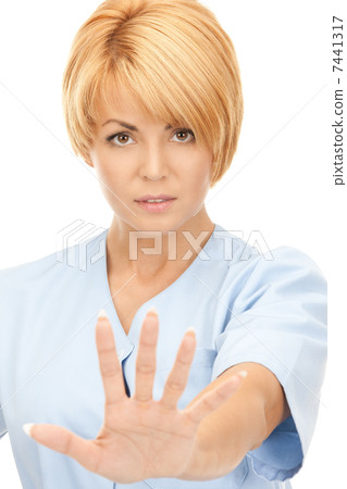 attractive female doctor showing stop gesture attractive female doctor showing stop gesture 7441317