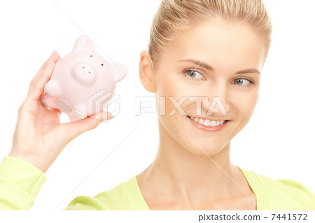 woman with piggy bank woman with piggy bank 7441572