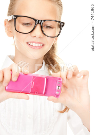 happy girl taking picture with cell phone 7441966