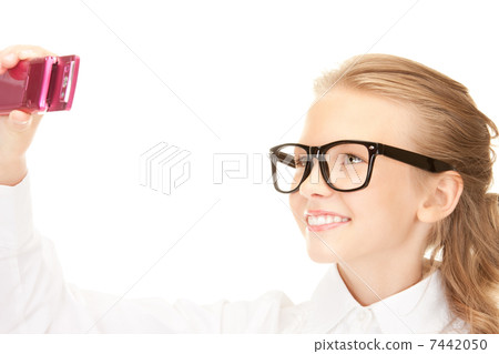 happy girl taking picture with cell phone 7442050