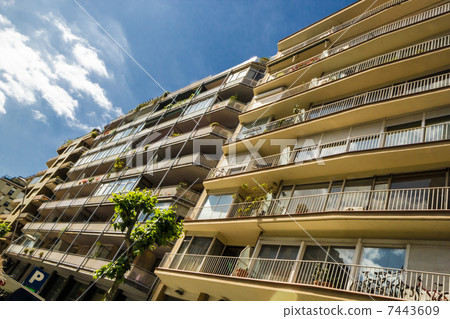 Modern executive apartments with balconies and sky. 7443609
