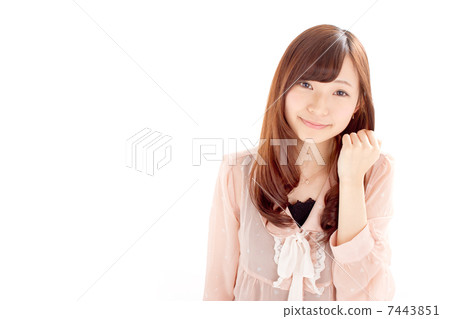 Pretty girl holding a fist and playing a guts pose 7443851