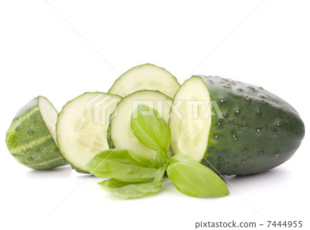 Sliced cucumber vegetable and basil leaves still life 7444955
