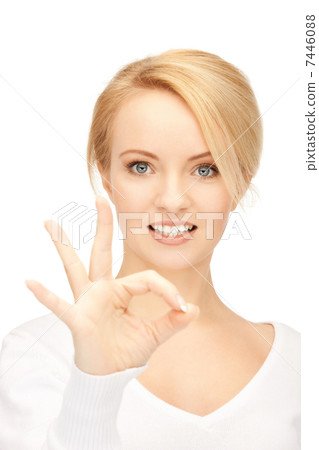 lovely teenage girl showing ok sign 7446088