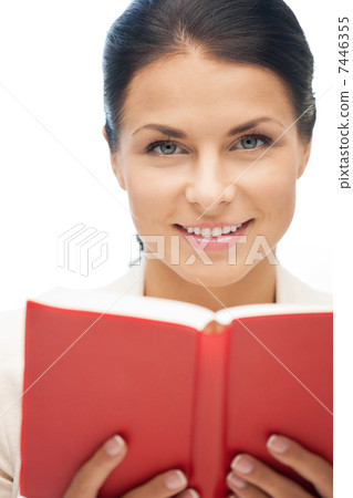 happy and smiling woman with book 7446355