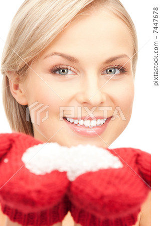woman in mittens with snow woman in mittens with snow 7447678