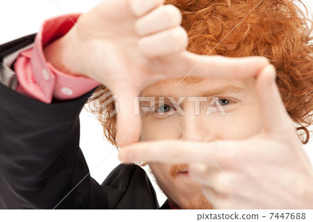handsome man creating a frame with fingers handsome man creating a frame with fingers 7447688