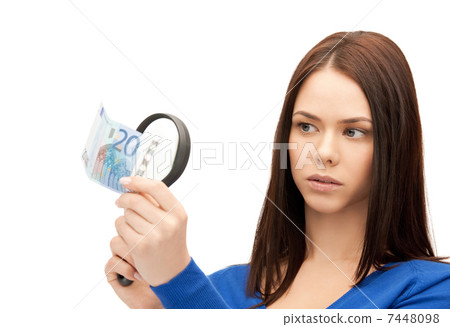 woman with magnifying glass and euro cash money 7448098
