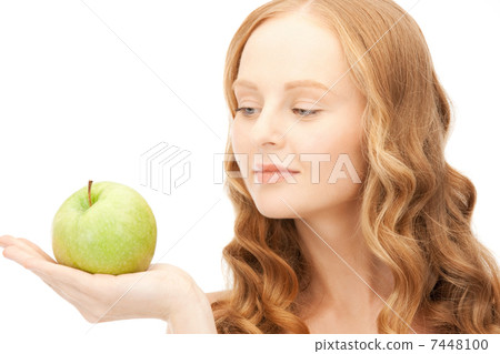 young beautiful woman with green apple 7448100