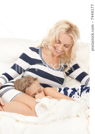 happy mother and sleeping girl 7449177