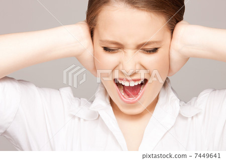 woman with hands on ears woman with hands on ears 7449641