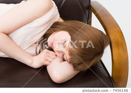 Woman sleeping on sofa Woman sleeping on sofa 7456148