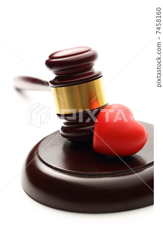 Judge's wooden gavel and red heart Judge's wooden gavel and red heart 7458160