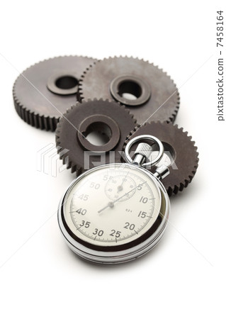 Four steel cogwheels and stopwatch 7458164
