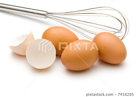 Eggbeater and eggs isolated on white Eggbeater and eggs isolated on white 7458285