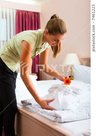 Maid doing room service in hotel 7461223
