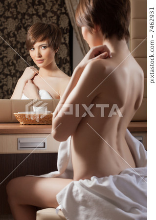 Beautiful girl posing naked near mirror Beautiful girl posing naked near mirror 7462931