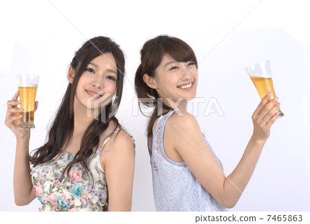 Two women drinking beer Two women drinking beer 7465863