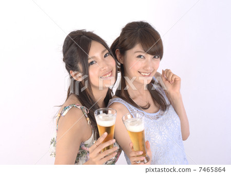 Two women drinking beer Two women drinking beer 7465864