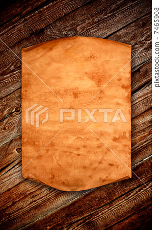 Blank old paper against the background of an aged wood Blank old paper against the background of an aged wood 7465908