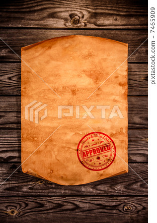 Blank old paper against the background of an aged wood Blank old paper against the background of an aged wood 7465909