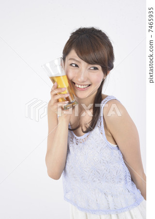 Young woman drinking beer Young woman drinking beer 7465935