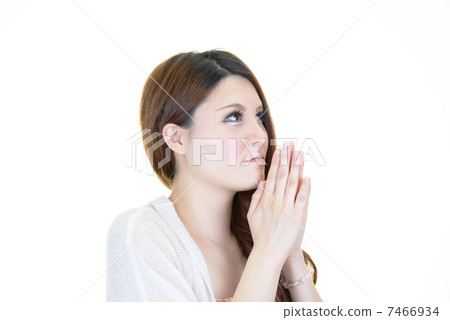 A woman praying A woman praying 7466934