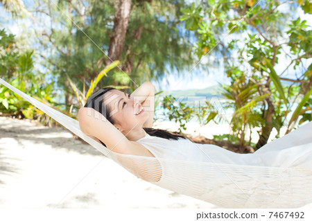 A woman sleeping in a hammock A woman sleeping in a hammock 7467492