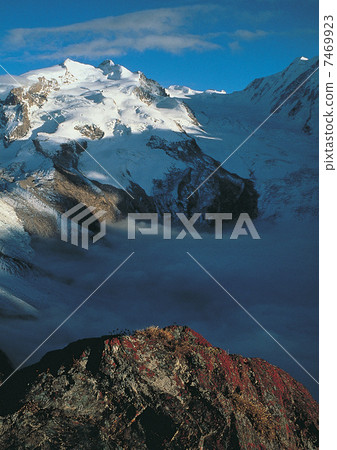 Moutain peak covered with snow of Alps Moutain peak covered with snow of Alps 7469923