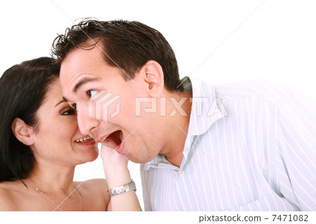 girl tells something into surprised guy's ear isolated on white girl tells something into surprised guy's ear isolated on white 7471082