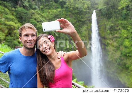 Couple tourists taking self portrait on Hawaii 7472070