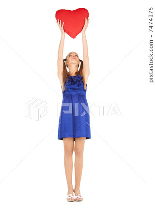 lovely woman with red heart-shaped pillow lovely woman with red heart-shaped pillow 7474175
