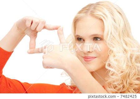 lovely woman creating a frame with fingers 7482425