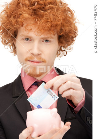 man with piggy bank and money man with piggy bank and money 7482470