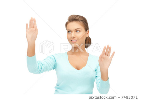 businesswoman working with something imaginary businesswoman working with something imaginary 7483071