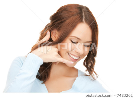 woman making a call me gesture 7483261