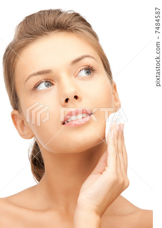 beautiful woman with cotton pad 7484587