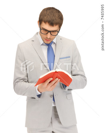 calm and serious man with book 7485995
