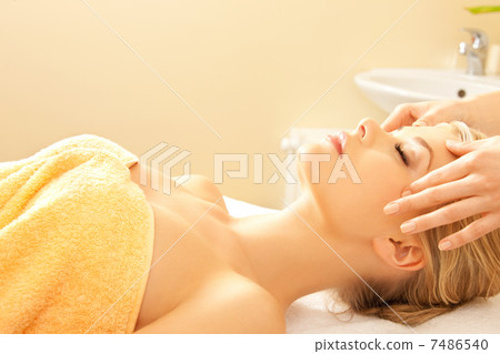 beautiful woman in massage salon 7486540