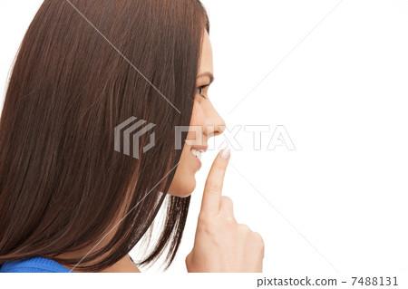 happy woman with finger on lips 7488131