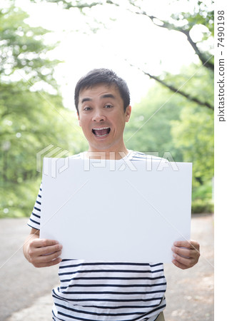 A man with a message board A man with a message board 7490198